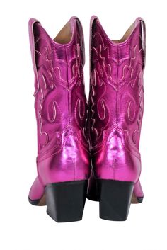 Shine on at your next rodeo with Dolce Vita's metallic pink short boots. Made with a leather upper and a western-style cut, these boots add a playful touch to any outfit. Pair with a leather skirt and a bodysuit for girls night out! Size 7.5 Leather upper Pull on Side pull tabs Blemish near inner left trim Heel height 2.5" Shaft 9.5" Circumference 13" Western Style Pink Mid-calf Boots, Pink Fitted Western Mid-calf Boots, Western Style Fitted Pink Mid-calf Boots, Pink Western Boots For Fall, Western Style Pink Mid-calf Boots For Winter, Pink Western Style Mid-calf Boots For Winter, Pink Western Style Heeled Boots With Round Toe, Pink Heeled Boots With Snip Toe For Fall, Pink Snip Toe Heeled Boots For Fall