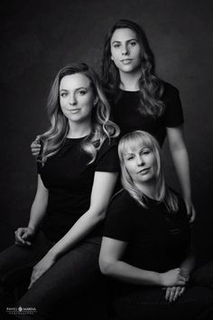 three women are posing for a black and white photo