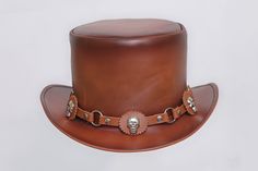 Description: * High-Quality Craftsmanship hand made * Real Leather * 100% pure leather **Those living in remote areas will have to pay $50 extra as shipping charges before the item is shipped. Sizing Heads come in all sizes, and in a lots variety of shapes. Although high quality hats are adaptable, and will usually conform to differences in shape with a little wearing, it is essential that the size be correct for the head. To determine your hat size, measure the circumference around your head, k Steampunk Leather Hat Band With Short Brim, Leather High Crown Top Hat For Festival, Steampunk Leather Hat With Adjustable Fit, Adjustable Leather Steampunk Hat, Brown Steampunk Hat With Short Brim, Steampunk Leather Brimmed Hat Bands, Vintage Leather Hat With High Crown, Steampunk Leather Hat For Festivals, Vintage Leather Hat Bands For Flat Crown