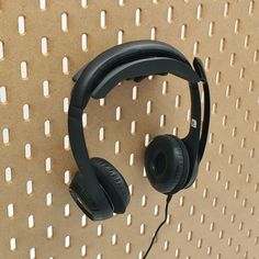 a pair of headphones hanging on a wall