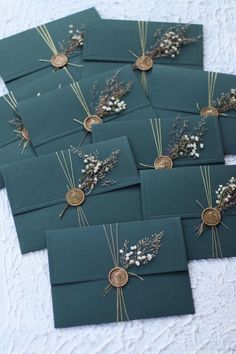 there are many small cards with flowers on them, and some have tags attached to them