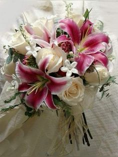 a bridal bouquet with pink and white flowers