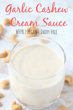 garlic cashew cream sauce in a glass bowl with cashews on the side