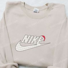 Hat Xmas x Nike Embroidered Shirt: Add a touch of festive spirit to your wardrobe with our Hat Xmas x Casual Cotton Christmas Sweatshirt, Casual Christmas Cotton Sweatshirt, Christmas Streetwear Cotton Sweatshirt, Christmas Cotton Sweatshirt For Streetwear, Casual Christmas Hoodie With Crew Neck, Casual Christmas Sweatshirt For Festive Occasion, Casual Christmas Festive Sweatshirt, Casual Cotton Christmas Hoodie, Casual Embroidered Christmas Top