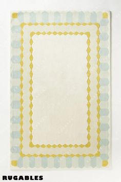 a white and blue square with yellow border