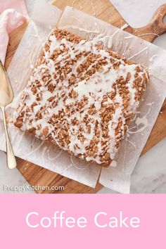 a close up of a cake on a cutting board with the words coffee cake above it