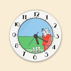 a clock with an image of two people in a red wagon on the front and back of it