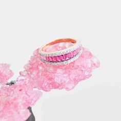 Step into a world of timeless beauty and sophisticated allure with our exquisite 18-karat gold Pink Tourmaline Baguette Diamond Contemporary Wedding Band Ring. This enchanting piece is a true masterpiece, expertly designed to capture the essence of art, color, and culture in a seamless blend of elegance and contemporary charm.