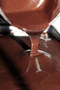 the chocolate is being poured onto the table