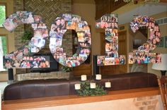 the number 30 is made up of photos and candles in front of a fireplace mantle