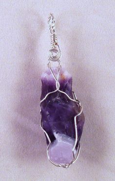 Custom made Sterling Silver wire wrapped Amethyst crystal hand crafted high in the mountains of Northern New Mexico by the artists at Alta Studios. Each piece is hand made - Item shipped may vary slighty from item shown in pictures. 8 oz. Shipping Weight * Necklace not included * Wire Wrapped Crystals For Jewelry Making, Unique Amethyst Wire Wrapped Crystal Necklace, Handmade Amethyst Pendant Crystal, Handmade Bohemian Purple Crystals, Wrap Crystals, Crystal Ideas, Wrapped Crystals, Wired Jewelry, Northern New Mexico