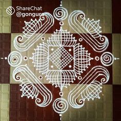 an intricately designed design on the floor in front of a door with words that read sharechat @ agongur