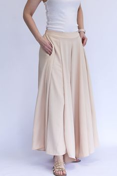 Be the talk of every room with our Keep it Glowing - Woven Wide Leg Pants! These champagne, satin pants are beyond gorgeous. They give the illusion of a skirt, but bring the comfort of pants. This item has a high waist, elastic waist band, and pockets. We love these so much because you can throw on a blouse to dress them up, or a tank to dress them down. You can wear these for any occasion and be the most stylish gal in the room! - Champagne colored woven wide leg pants - High waist - Elastic wa Spring Wide Leg Bottoms With Waistband, Elegant High Waist Beige Culottes, High-waisted Pants With Waistband For Spring, Spring Wide Leg Pants With Waistband, Beige Full-length Bottoms With Elastic Waistband, Full Length Beige Bottoms With Elastic Waistband, Fitted Beige Wide Leg Pants With Elastic Waistband, Chic Wide Leg Bottoms With Waistband, Elegant Beige Wide Leg Pants With Elastic Waistband