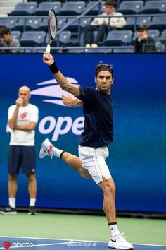 a male tennis player in action on the court