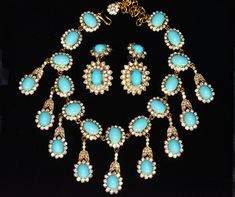 Magnificent Rare Kenneth Jay Lane Necklace and Earring Ensemble This set was designed with turquoise cabochons surrounded by glimmering clear rhinestones set in goldtone. The bib necklace extends with a row of oval cabochons from which dangle rhinestone surrounded ovals from a rhinestone laden flared strand element to a length of 2 1/4 inches. This stunning necklace measures 16 inches long including a 3 1/2 inch extender and has a J hook closure. The matching clip dangle earrings have a single rhinestone surrounded turquoise cabochon at the clip from which hang a double row of rhinestones around an oval cabochon. The earrings are 1 7/8 inches long. All pieces are in excellent condition. MARKED KJL. AN INVESTMENT FOR THE FUTURE....AN ADORNMENT TO WEAR NOW! MAKE IT YOURS!! Necklace And Earring Set, Stunning Necklace, Kenneth Jay Lane, Bib Necklace, Rhinestone Necklace, Oval Cabochon, Clear Rhinestones, Costume Jewelry, Antique Jewelry