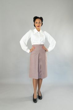 Wide-cut, calf-length skirt with a wide waistband in 40s style. It has a deep box pleat at the front and back. The skirt is lined, All models are made in my studio in Berlin. Outer fabric: 100% virgin wool Dry cleaning Size 34: Bust 80 cm, waist 64 cm, hips 86 cm Size 36: Bust 84 cm, waist 68 cm, hips 90 cm Size 38: Bust 88 cm, waist 72 cm, hips 94 cm Size 40: Bust 92 cm, waist 76 cm, hips 98 cm Size 42: Bust 96 cm, waist 80 cm, hips 102 cm Size 44: Bust 100 cm, waist 84 cm, hips 106 cm Size 46: Elegant Long Pencil Skirt For Daywear, Elegant Long Pencil Skirt, Elegant Pleated Skirt Bottoms For Daywear, Fitted Full Pleated Skirt For Formal Occasions, Elegant Pleated Skirt For Daywear, Formal Fitted Full Pleated Skirt, Elegant Daywear Pleated Skirt, Elegant Full Pleated Skirt For Daywear, Tailored Classic Knee-length Bottoms