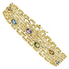 A fashionable wide bracelet showcasing polished 14K Yellow Gold links, weighing 34.49 grams. Accented by colorful gemstones consist of Amethyst, Citrine, Topaz and Peridot with 10.00 carats total. Roman Malakov is a custom house, specializing in creating anything you can imagine. If you would like to receive a special quote on a custom piece please message or call us. Pyramid Bracelet, Colorful Gemstones, Nugget Bracelet, Retro Bracelet, Gold Link Bracelet, Wide Bracelet, Yellow Gold Bracelet, Lovely Jewellery, Gemstone Colors