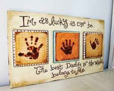 a wooden sign with handprints on it that says, i'm 3 lucky as come be the best daddy in the world belongs to me