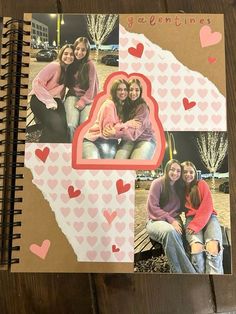 a scrapbook with pictures of two women and hearts on the cover, sitting on a wooden table