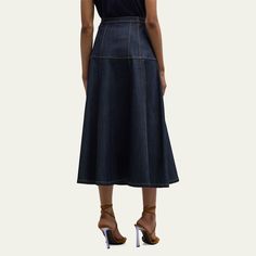 Cinq a Sept "Veena" skirt in dark-wash denim with contrast stitching  Three-pocket style  High rise Hem falls below the knee A-line silhouette Button front; belt loops  Polyurethane/viscose Lining: Cotton Dry clean Imported High Rise Skirt, Cinq A Sept, Denim Pencil Skirt, Denim Midi Skirt, Dark Wash Denim, Contrast Stitch, The Knee, Denim Skirt, Pencil Skirt