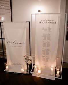 candles are lit in front of a welcome sign and wall hangings that read, be our guest