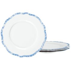 two blue and white plates sitting next to each other