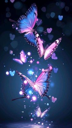 three purple butterflies flying in the air with hearts floating around them on a dark blue background