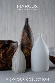 three vases sitting next to each other in front of a gray background with the words, view our collection