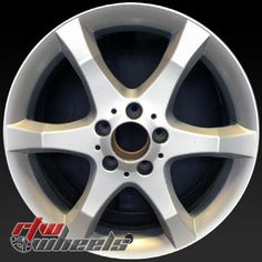 an image of a white wheel with gold spokes on the rim for a car