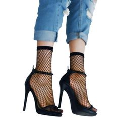 Introducing the Women's Medium Gauge Fishnet Socks, a must-have accessory to elevate your style and make a bold fashion statement. Crafted with a blend of 88% Nylon and 12% Spandex, these socks offer durability, comfort, and stretchability. Designed with a medium gauge, these fishnet socks are super trendy and feature a solid elastic cuff for a secure fit. The bold elastic band adds a touch of flair and ensures the socks stay in place throughout the day. Their imported construction guarantees qu Black Mesh Socks For Summer, Black Mesh Hosiery For Summer, Party Fishnet Socks, Summer Party Black Hosiery, Black Mesh Socks For Spring, Chic Black Fishnet Hosiery, Trendy Party Fishnet Hosiery, Spring Black Mesh Socks, Trendy Party Socks With Stretch