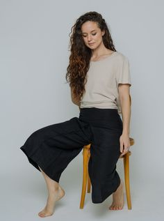 Feminine like a skirt, but the practicality of pants. These culottes are perfect all year long, and can be dressed up or down with flats, heels or your favourite boots. STYLE #1815: Wide leg culottes pants with centre pleat detail and front pockets. Fully lined. The fabric of this item is woven, with no stretch, and fits true to size. Available in Black Silky, Black or Navy. FABRIC: 55% Hemp, 45% LyocellLINING: 100% Bemberg Rayon FIT: Measurements of a size 8 Waist: 30" Length: 30" (from waist t Stylish Capsule Wardrobe, Wide Leg Culottes, Culottes Pants, Mandarin Collar Shirt, Denim Workwear, Work Socks, Boots Style, Fashion Revolution, Favorite Boots