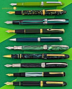 different types of fountain pens lined up on top of each other, all in different colors