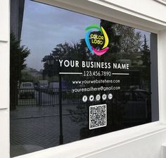 a business sign in the window of a building