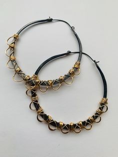 "** Due to excessively long delivery times and issues with Customs I no longer ship to Germany. I am sorry for any inconvenience. These large 2.5\" diameter hoops are made out of solid hypoallergenic black niobium that has been carefully wrapped in 14k gold fill wire. Lightweight despite their size, they are finished with black niobium earwires." Black Hoops Earrings, Brass Hoop Earrings, Big Hoop Earrings, Brass Hoops, Rustic Jewelry, Large Hoop Earrings, Big Earrings, Gold Wire, Gorgeous Earrings