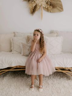 Introducing the breathtaking Harper dress in dusty pink—an elegant choice for flower girls or special occasions. Featuring a tea-length soft tulle skirt with four layers for fullness, a comfortable cotton bodice, adjustable tulle tie straps, and stretchy shirring at the back for a perfect fit. Designed exclusively by Oui Babe, this dress is a showstopper for your little one!