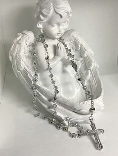 This rosary was created with 6mm faceted silver crystals, silver pins, a silver Virgin Mary center, silver tone heart shaped Our Father beads and an awesome cross with inset rhinestones matching the beauty of the beads.  Measures 18". Angel Pics, Dream Items, Bead Rosary, Girl Blogger, Our Father, Finding God, Silver Pin, Blogger Girl, Faceted Crystal