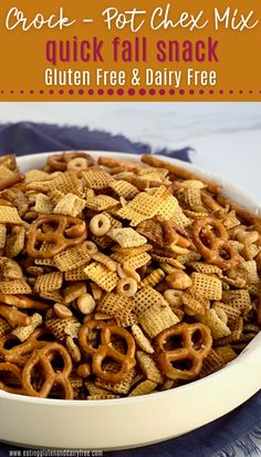 a white bowl filled with cracker - pot chex mix next to a blue napkin