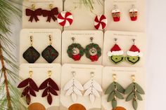 christmas themed earrings are displayed on display