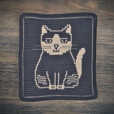 a crocheted square with a cat on it