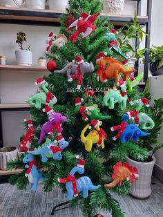 a small christmas tree decorated with stuffed animals