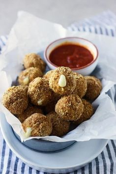 some food is sitting on a plate with dipping sauce