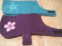 three oven mitts with flowers and stars on them