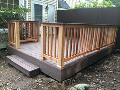 a wooden deck in front of a house