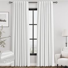 a white curtain hanging in front of a window