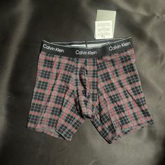 Calvin Klein Boxer Brief Small Charcoal Heather, Red, And Black Striped Design For A Plaid Pattern. Please Note: Due To The Natural Variance And Characteristic Of The Yarns/Fabrics, Slight Variations In Pattern May Occur New With Tags, Not Worn, Perfect Condition 95% Cotton 5% Spandex Limited Edition Holiday Styling. Full Rise. Waistband Sits At The Regular Level, Above Hip. Leg Line Sits Low On Thigh. Contoured Pouch For Support. Soft, Flexible Logo Waistband Retains Shape Wear After Wear. Fitted Cotton Multi-pack Boxer Briefs, Casual Fitted Multi-pack Boxer Briefs, Fitted Casual Boxer Briefs Multi-pack, Fitted Cotton Boxer Briefs For Loungewear, Fitted Casual Boxer Briefs, Casual Fitted Boxer Briefs, Fitted Red Cotton Boxer Briefs, Red Fitted Cotton Boxer Briefs, Calvin Klein Boxer Briefs