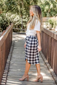 Looking for a weekend skirt that's both cozy and stylish? Look no further than our Buffalo Plaid Weekend Skirt! This skirt is the perfect combination of cute and comfortable, with a knee-length cut and a self-tie waistband that'll keep you feeling feminine and put-together all day long. Whether you're running errands or meeting up with friends for brunch, this skirt is sure to turn heads. And with sizing options ranging from S to 3X, it's easy to find the perfect fit for your body type.So why wa Midi Skirt For Daywear In Fall, Casual Relaxed Skirt For Daywear, Fall Day Out Bottoms With Tie Waist, Fall Bottoms With Tie Waist For Day Out, Fall Tie Waist Bottoms For Day Out, Chic Fall Skirt With Tie Waist, Casual Mini Skirt For Daywear, Casual Skirt With Elastic Waistband For Day Out, Flowy Skirt For Day Out In Fall