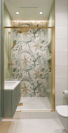 a bathroom with a toilet, sink and shower stall in the middle of the room