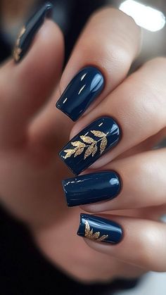 Navy with Gold Leaf nails bring a touch of luxury to your fall manicure. The deep navy base paired with shimmering gold leaf creates an elegant and eye-catching design. Click the pin and follow us for more chic nail ideas! #FallNails #GoldLeaf #NavyNails #NailArt #NailInspo Blue Fall Nail Designs, Navy Blue Wedding Nails, Navy Gold Nails, Navy Blue Nail Designs, Gold Gel Nails, Navy Nails, Fall Nail Ideas, Navy Blue Nails, Gold Nail Designs