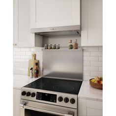 a stainless steel stove top oven in a white kitchen