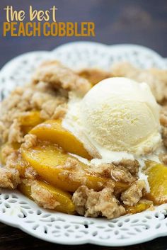 a white plate topped with peach cobbler and vanilla ice cream on top of it